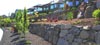 Rock wall built by Okanagan Company Redline Bobcat