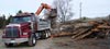 Redline bobcat delivery truck removing debris