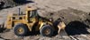 Redline Bobcat excavator moving soil and ogogrow